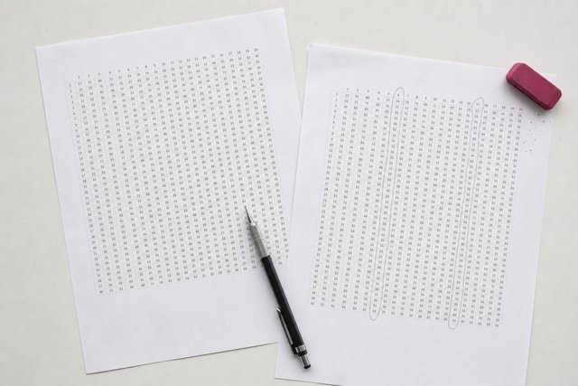 Two printed grids of figures side by side, one with columns circled in pencil